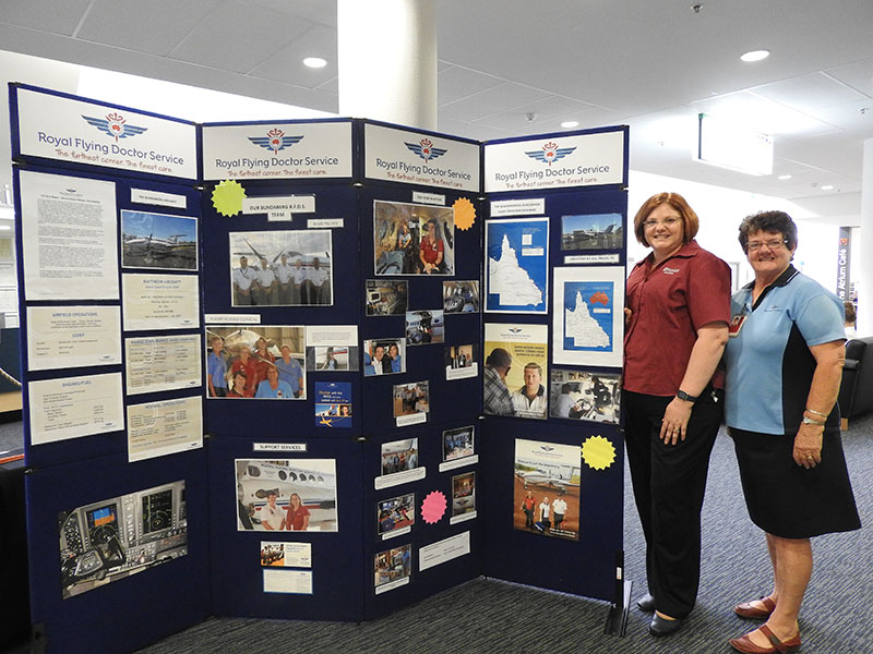 Friendly Society Private Hospital marketing coordinator Nikki Sorbello and Jennifer Leach from the Royal Flying Doctor Service with the display at The Friendlies. The wall was on display at The Friendlies for the month of January.